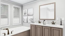 The THE SOUTHERN CHARM Primary Bathroom. This Manufactured Mobile Home features 3 bedrooms and 2 baths.