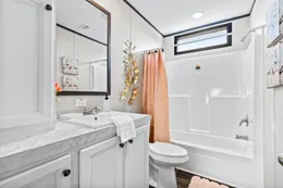 The THE REAL DEAL Guest Bathroom. This Manufactured Mobile Home features 3 bedrooms and 2 baths.