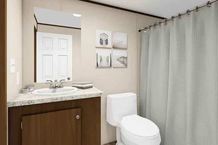 The PRIDE Guest Bathroom. This Manufactured Mobile Home features 4 bedrooms and 2 baths.