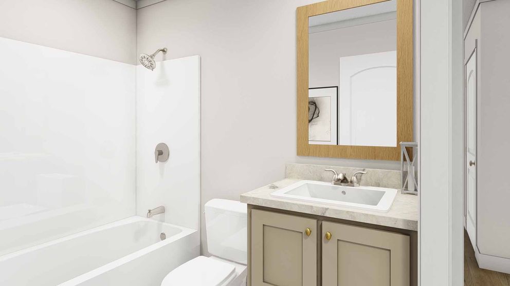 The MOVE ON UP Guest Bathroom. This Manufactured Mobile Home features 3 bedrooms and 2 baths.