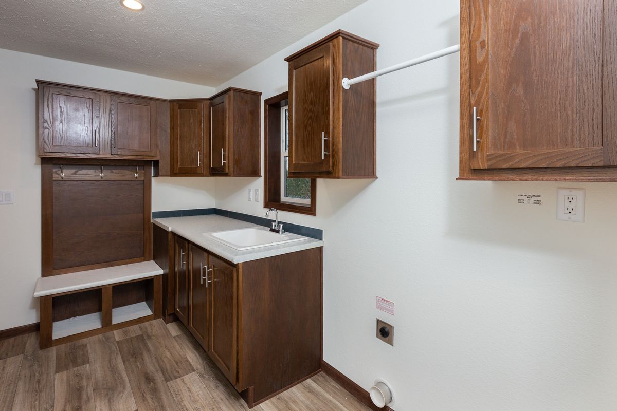 The LEGEND 86 Utility Room. This Manufactured Mobile Home features 3 bedrooms and 2 baths.