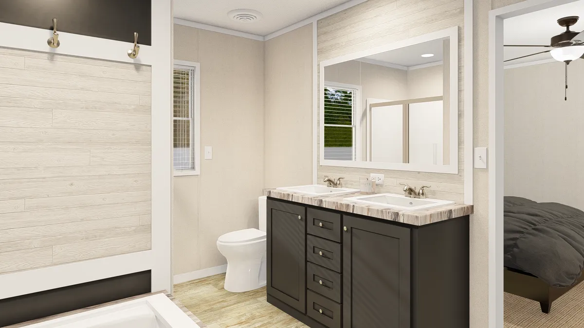 The GRAND LIVING 76B Primary Bathroom. This Manufactured Mobile Home features 3 bedrooms and 2 baths.