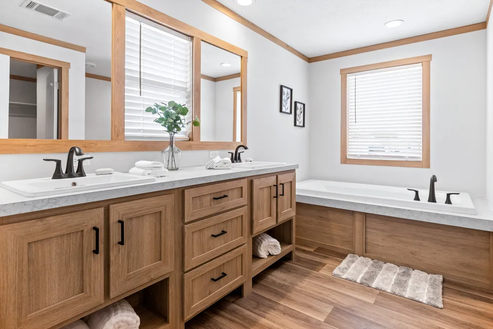 The HARPER Primary Bathroom. This Manufactured Mobile Home features 3 bedrooms and 2 baths.