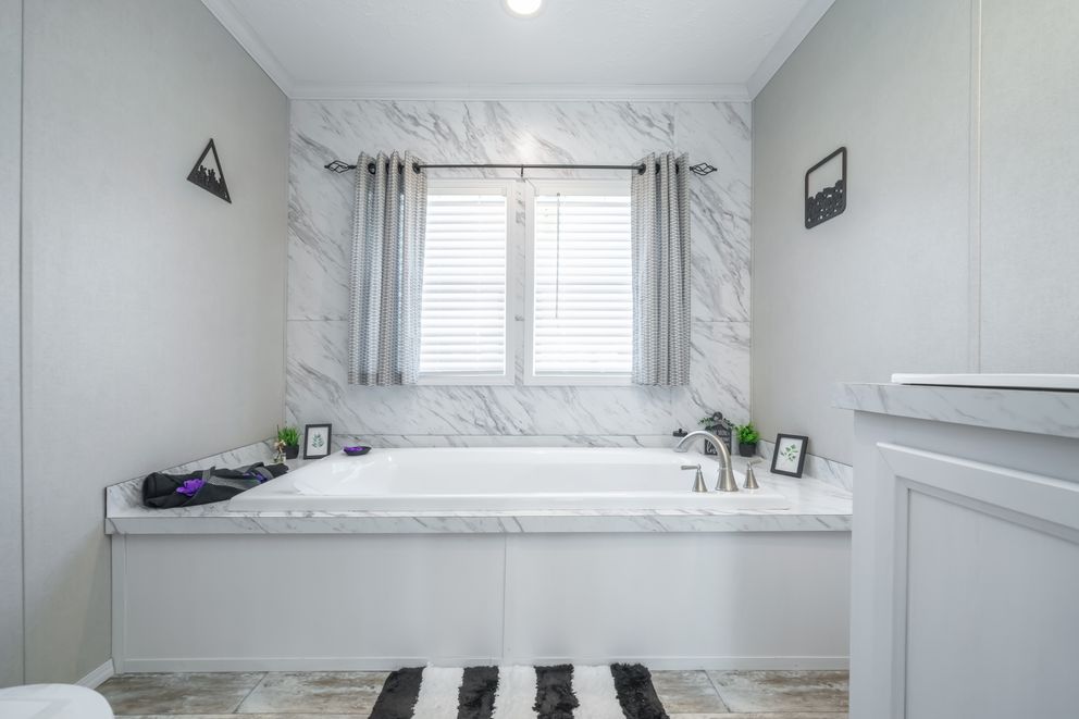 The STELLA Primary Bathroom. This Manufactured Mobile Home features 3 bedrooms and 2 baths.