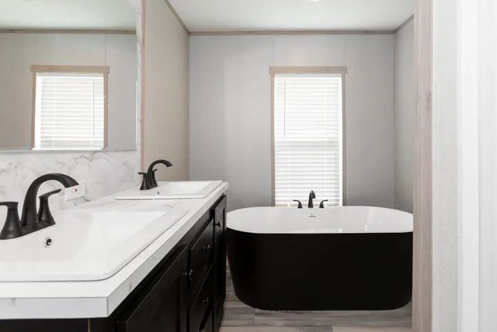 The THE ANNIVERSARY ISLANDER Primary Bathroom. This Manufactured Mobile Home features 3 bedrooms and 2 baths.