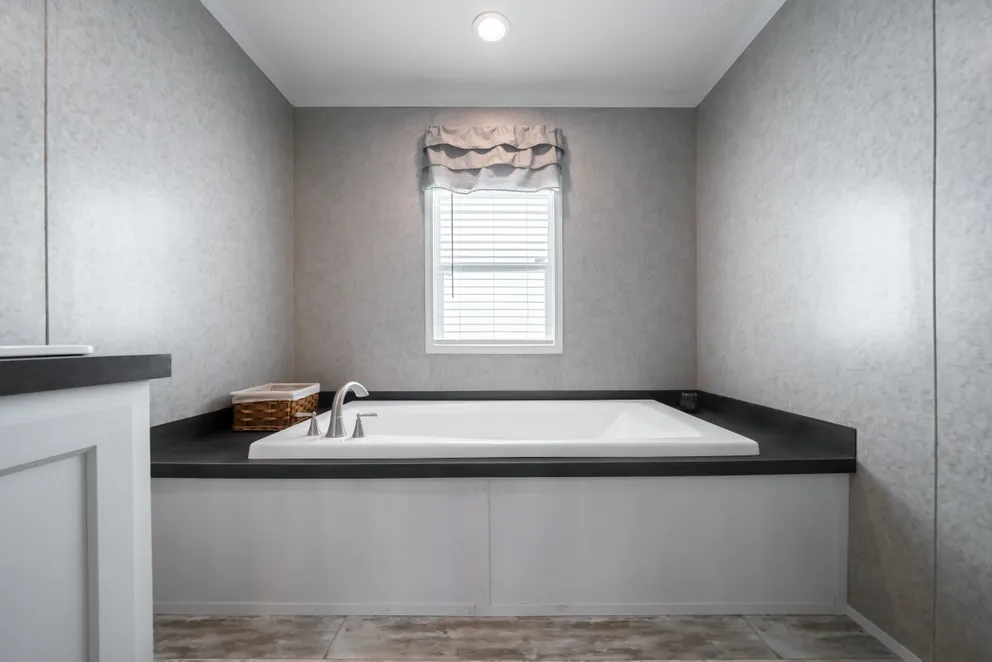 The NUMBER ONE Exterior. This Manufactured Mobile Home features 3 bedrooms and 2 baths.