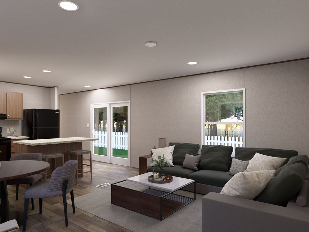 The ASPEN Living Room. This Manufactured Mobile Home features 3 bedrooms and 2 baths.