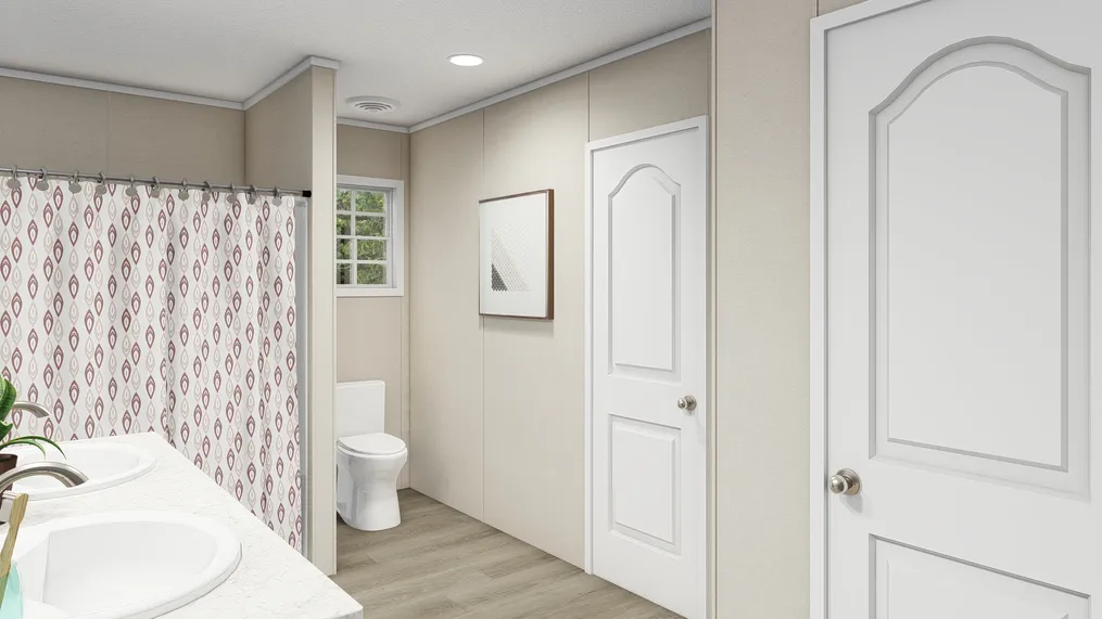 The LEGEND BIG BOY Primary Bathroom. This Manufactured Mobile Home features 4 bedrooms and 2 baths.