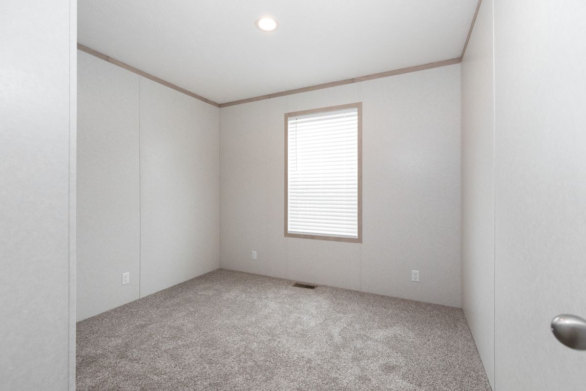 The 7616-4200 ADRENALINE Guest Bedroom. This Manufactured Mobile Home features 3 bedrooms and 2 baths.