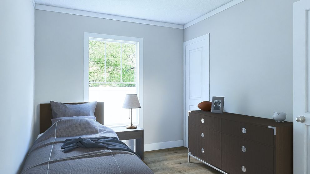 The RHYTHM NATION Guest Bedroom. This Manufactured Mobile Home features 3 bedrooms and 2 baths.