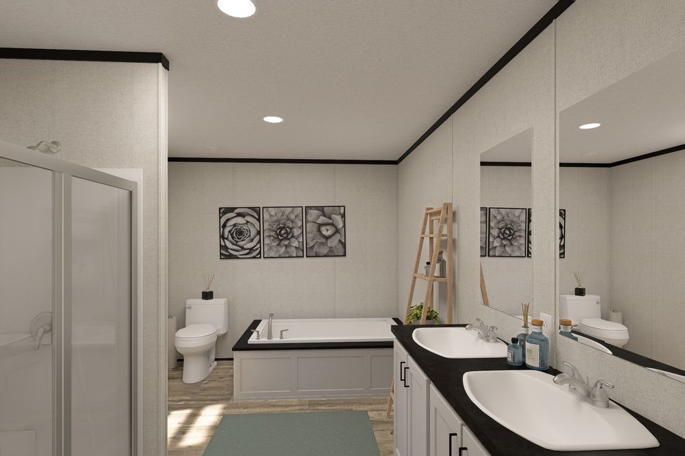 The THE MOUNTAINEER 48 Primary Bathroom. This Manufactured Mobile Home features 3 bedrooms and 2 baths.