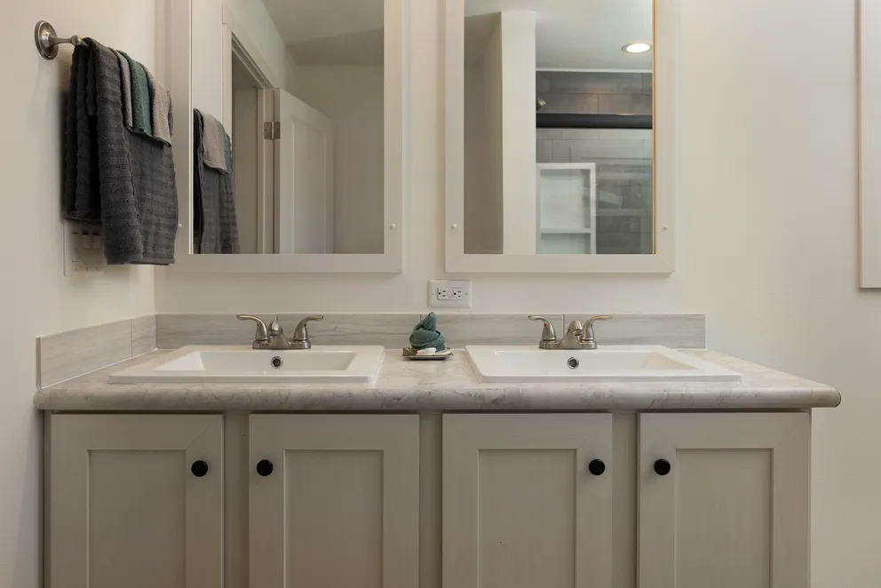 The HEY JUDE Primary Bathroom. This Manufactured Mobile Home features 4 bedrooms and 2 baths.