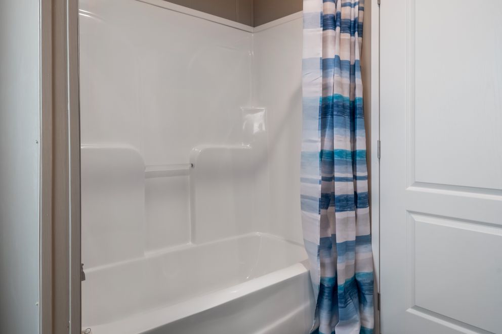 The ISLAND BREEZE 64 Guest Bathroom. This Manufactured Mobile Home features 4 bedrooms and 2 baths.