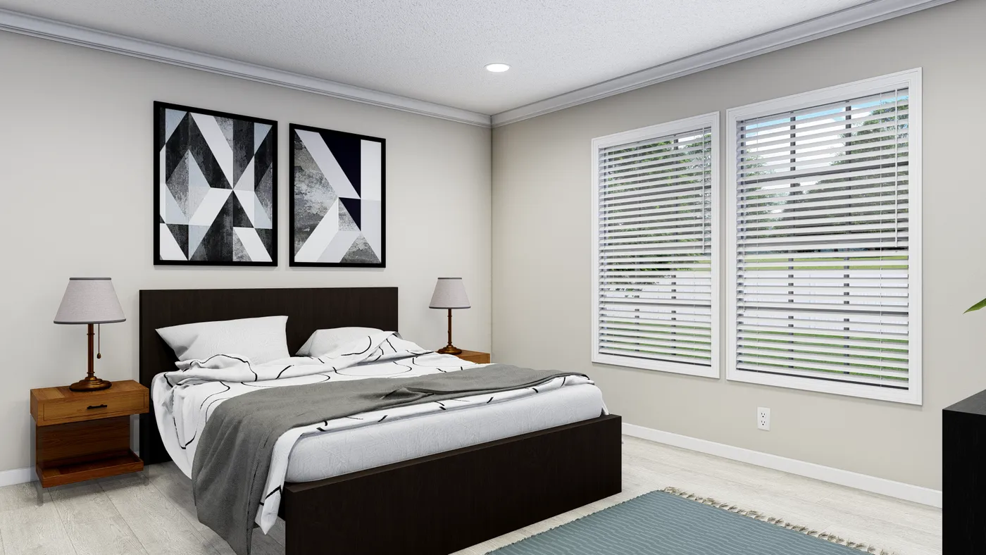 The PINEHURST 3104 Primary Bedroom. This Manufactured Mobile Home features 3 bedrooms and 2 baths.