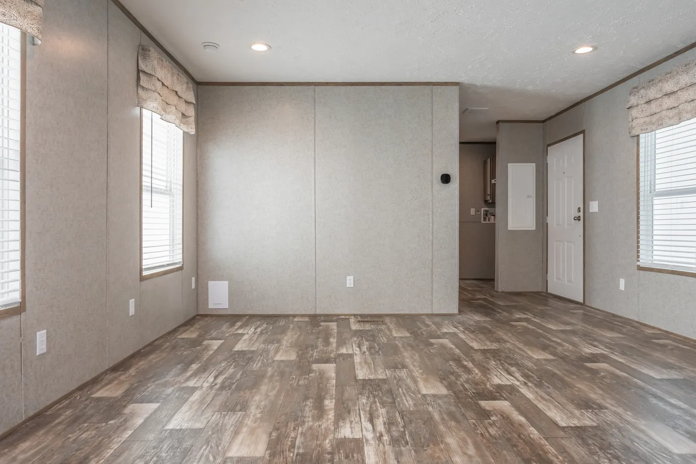 The LAKESIDE COTTAGE Living Room. This Manufactured Mobile Home features 1 bedroom and 1 bath.