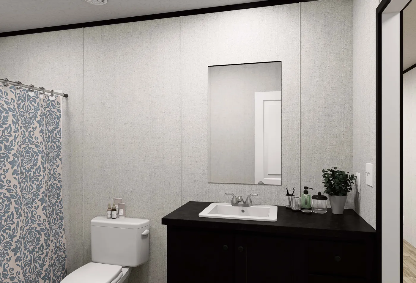 The DAWN Guest Bathroom. This Manufactured Mobile Home features 3 bedrooms and 2 baths.