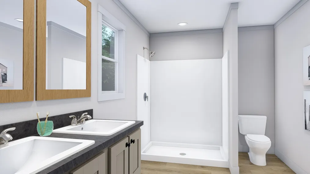 The LOVELY DAY Primary Bathroom. This Manufactured Mobile Home features 4 bedrooms and 2 baths.