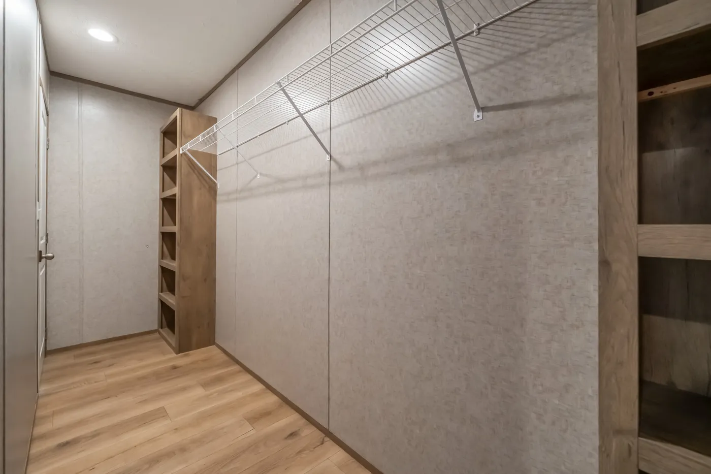 The WARRIOR II Primary Bedroom. This Manufactured Mobile Home features 2 bedrooms and 2 baths.