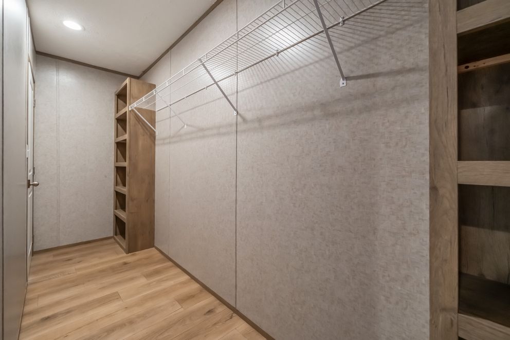 The WARRIOR II Primary Bedroom. This Manufactured Mobile Home features 2 bedrooms and 2 baths.