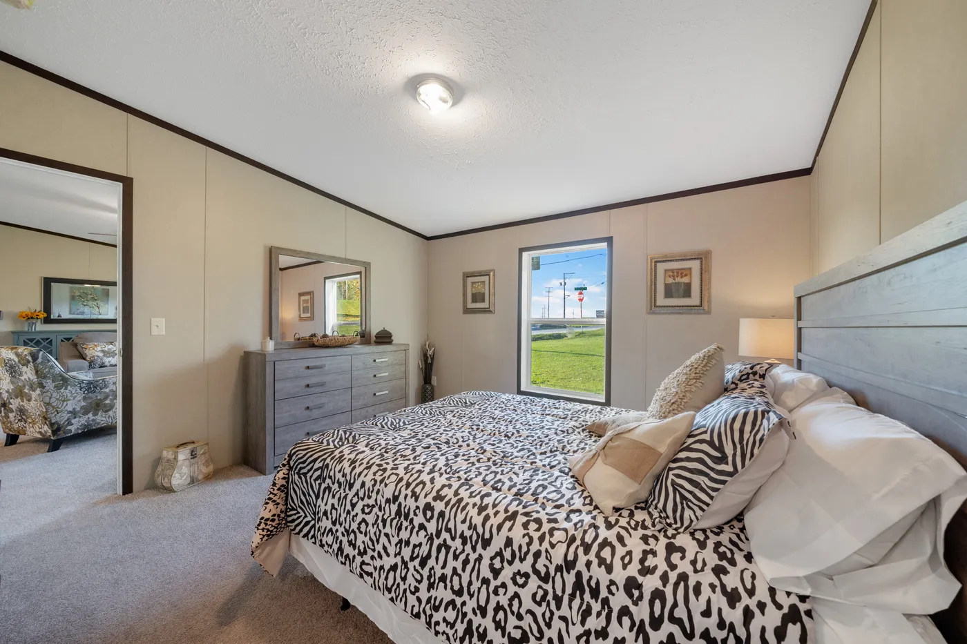 The GARNET Primary Bedroom. This Manufactured Mobile Home features 3 bedrooms and 2 baths.