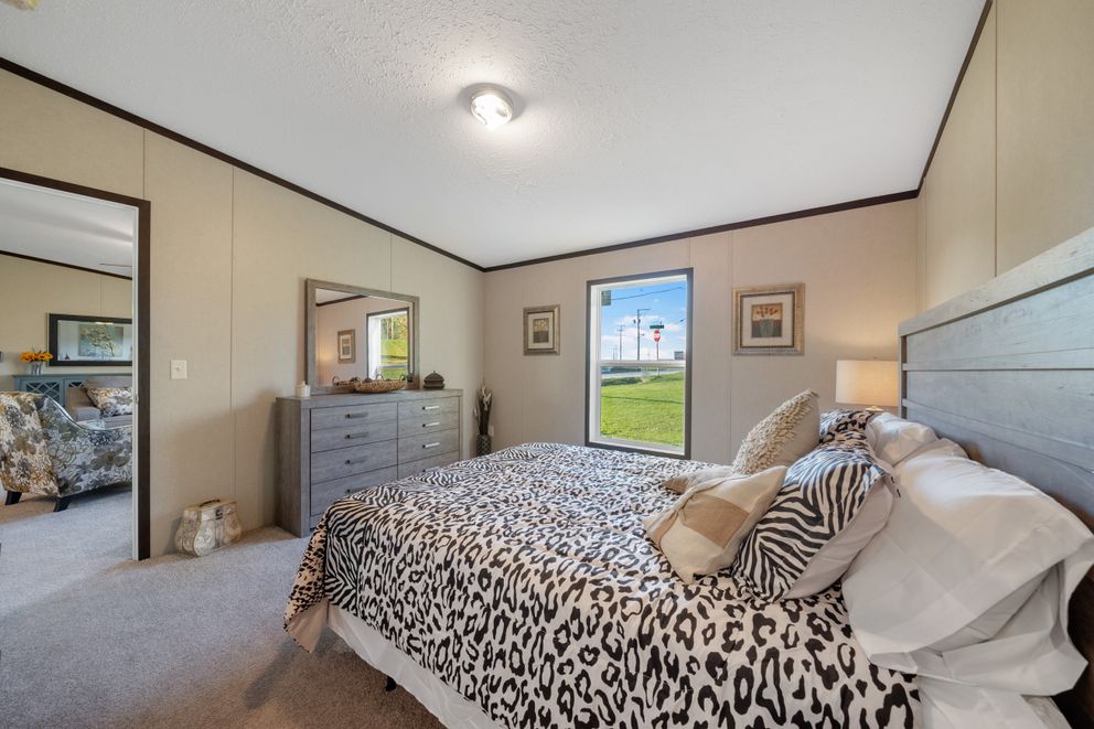 The GARNET Primary Bedroom. This Manufactured Mobile Home features 3 bedrooms and 2 baths.