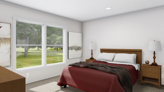 The LET IT BE Primary Bedroom. This Manufactured Mobile Home features 3 bedrooms and 2 baths.