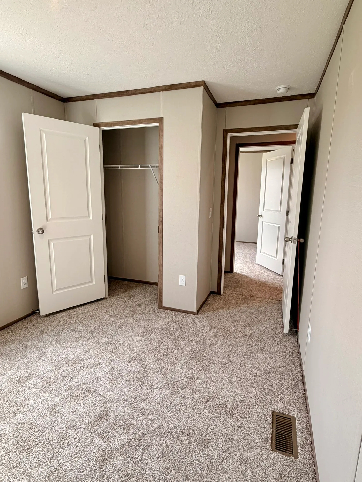 The APATITE Guest Bedroom. This Manufactured Mobile Home features 3 bedrooms and 2 baths.
