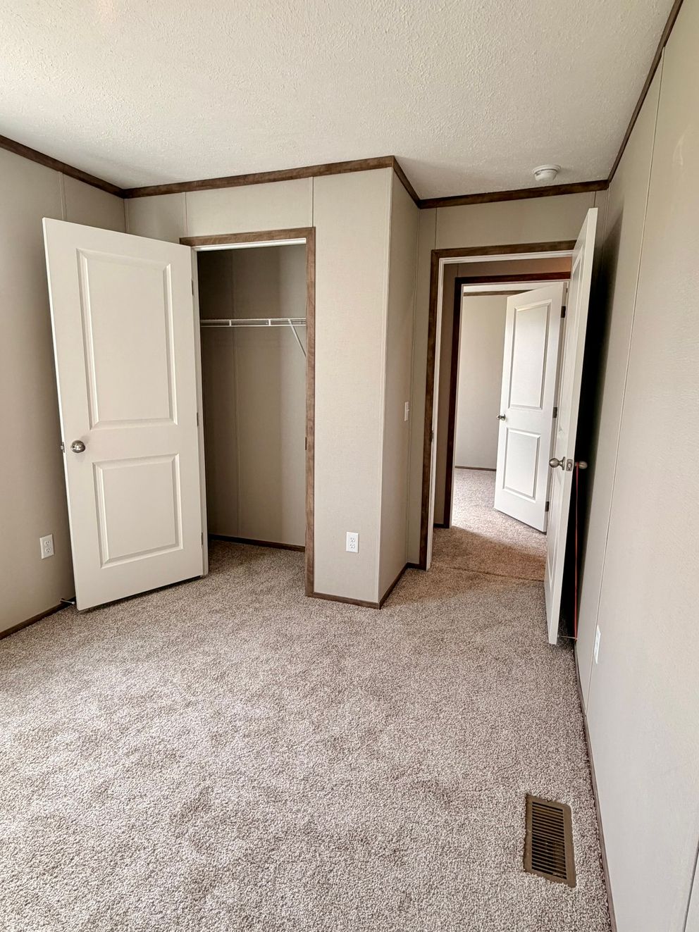 The APATITE Guest Bedroom. This Manufactured Mobile Home features 3 bedrooms and 2 baths.