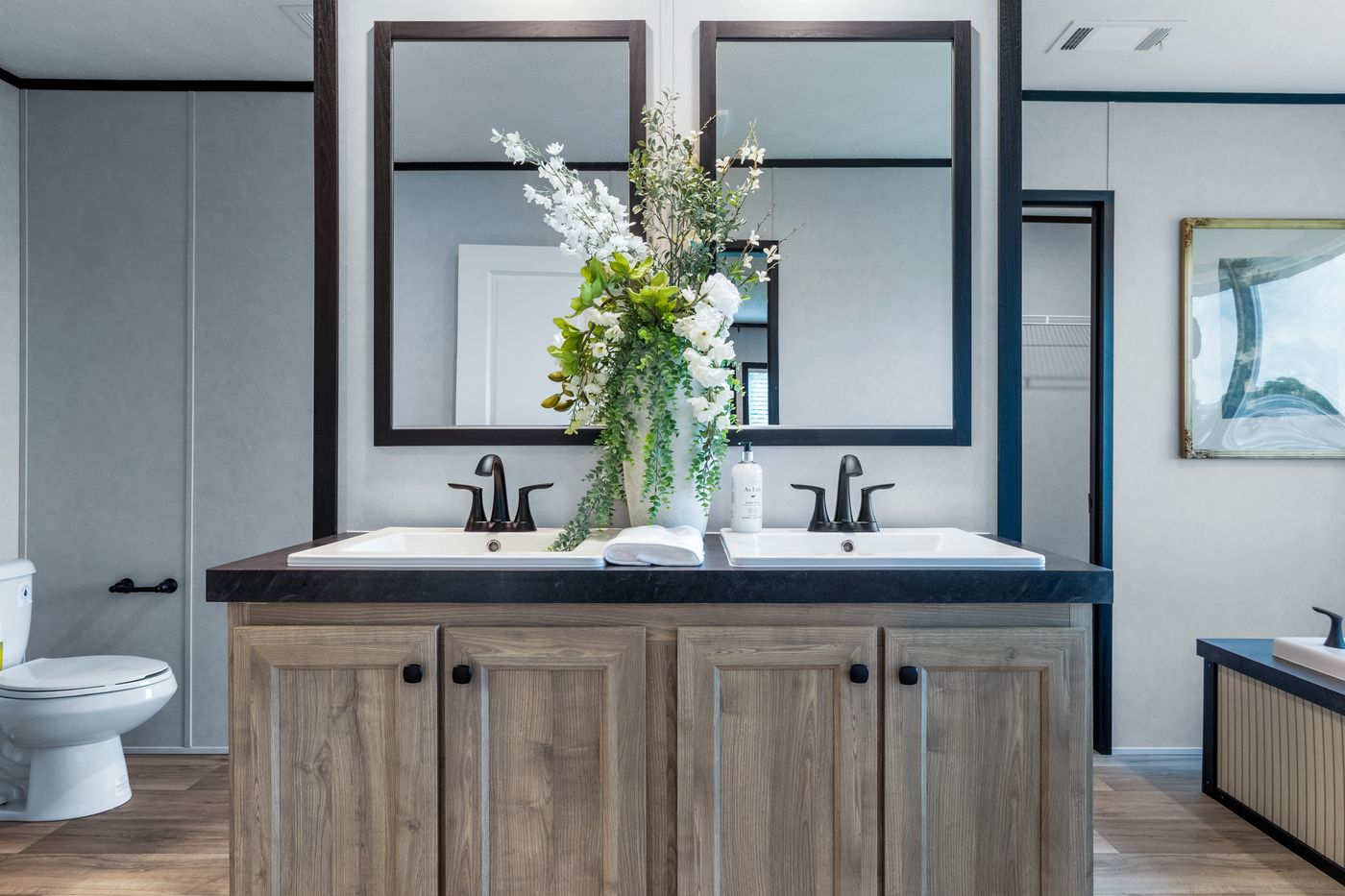 The ODYSSEY Primary Bathroom. This Manufactured Mobile Home features 4 bedrooms and 2 baths.
