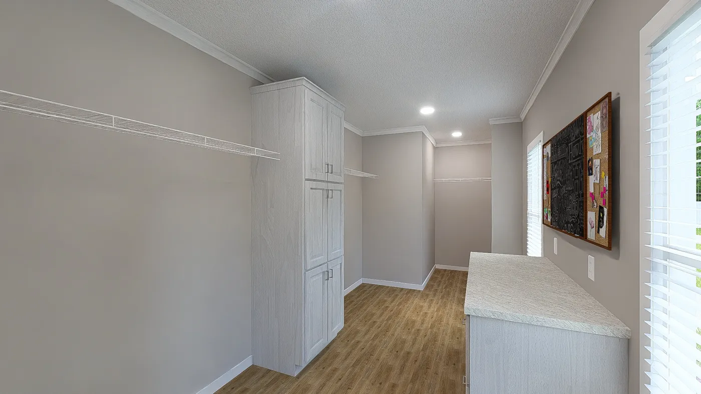 The THE HEXAGON Primary Bedroom Closet. This Manufactured Mobile Home features 4 bedrooms and 3 baths.