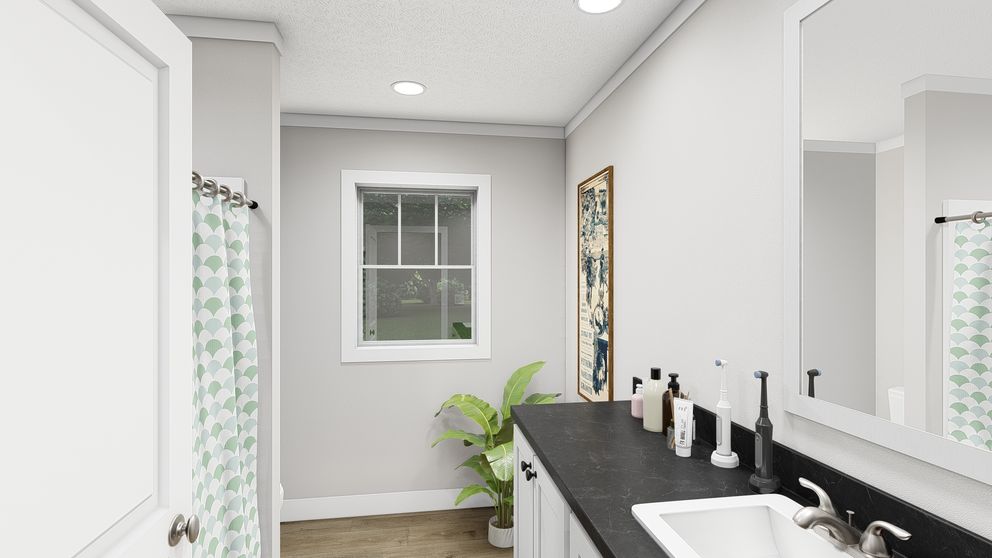 The SHOUT Guest Bathroom. This Manufactured Mobile Home features 3 bedrooms and 2 baths.
