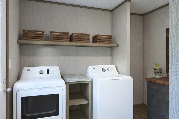 The EVEREST Utility Room. This Manufactured Mobile Home features 4 bedrooms and 2 baths.