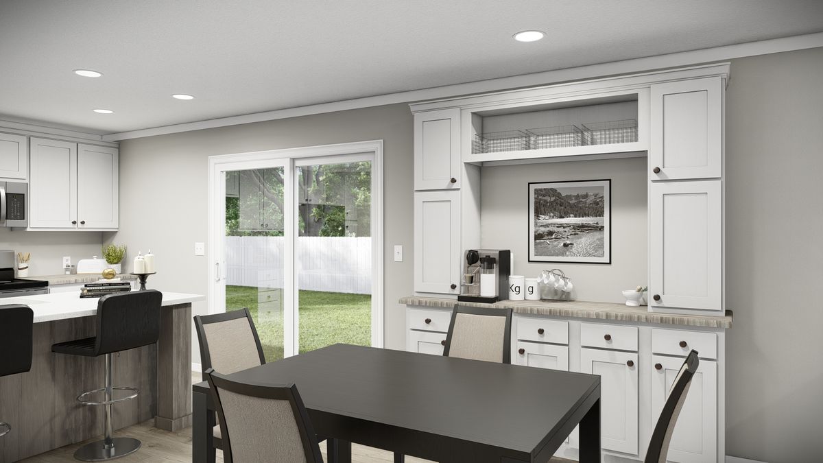 The THE REVERE Dining Area. This Manufactured Mobile Home features 4 bedrooms and 2 baths.