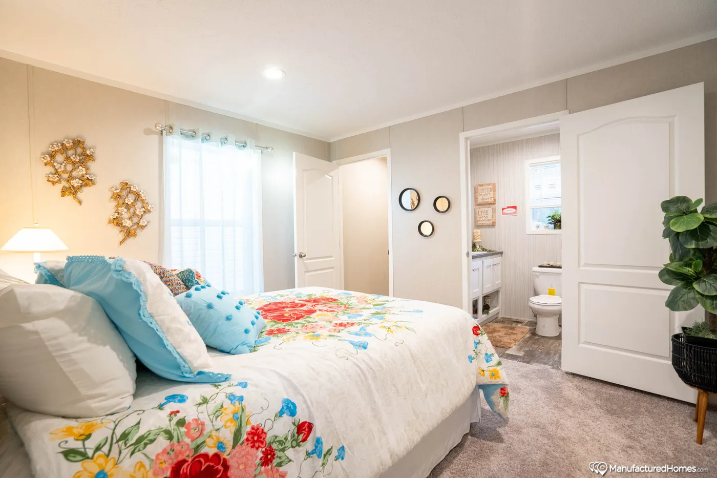 The TOPAZ 70 Primary Bedroom. This Manufactured Mobile Home features 3 bedrooms and 2 baths.