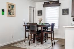 The SUNDANCE 48B Dining Area. This Manufactured Mobile Home features 3 bedrooms and 2 baths.