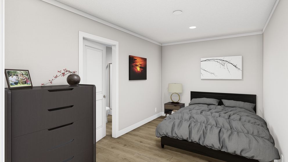 The RHYTHM NATION Primary Bedroom. This Manufactured Mobile Home features 3 bedrooms and 2 baths.