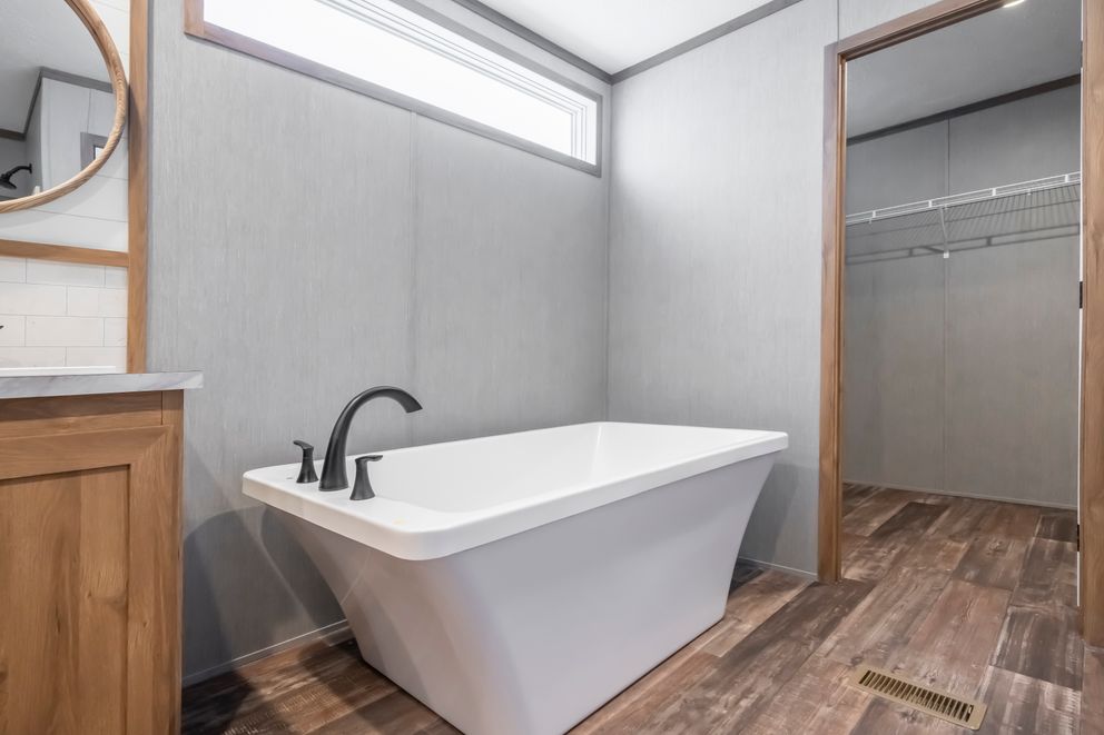 The BLACK DIAMOND Primary Bathroom. This Manufactured Mobile Home features 3 bedrooms and 2 baths.