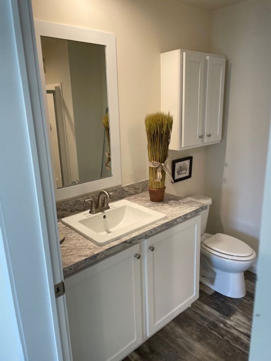 The AURORA/5228-MS049-1 SECT Primary Bathroom. This Manufactured Mobile Home features 3 bedrooms and 2 baths.