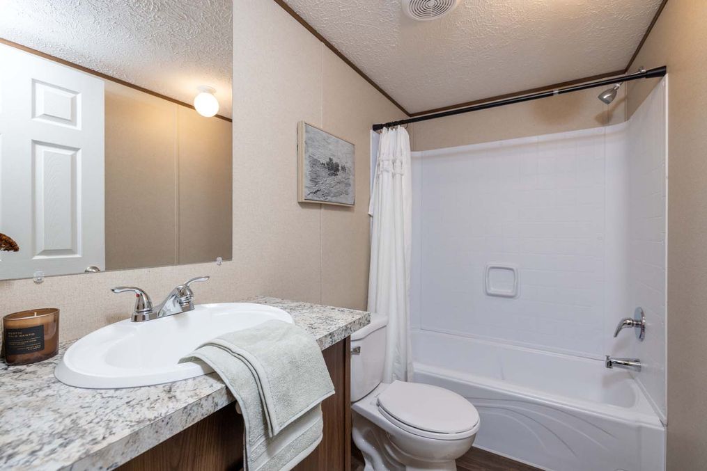The PRIDE Guest Bathroom. This Manufactured Mobile Home features 4 bedrooms and 2 baths.