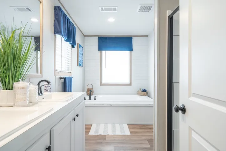 The EL SUENO BREEZE Primary Bathroom. This Manufactured Mobile Home features 4 bedrooms and 2 baths.