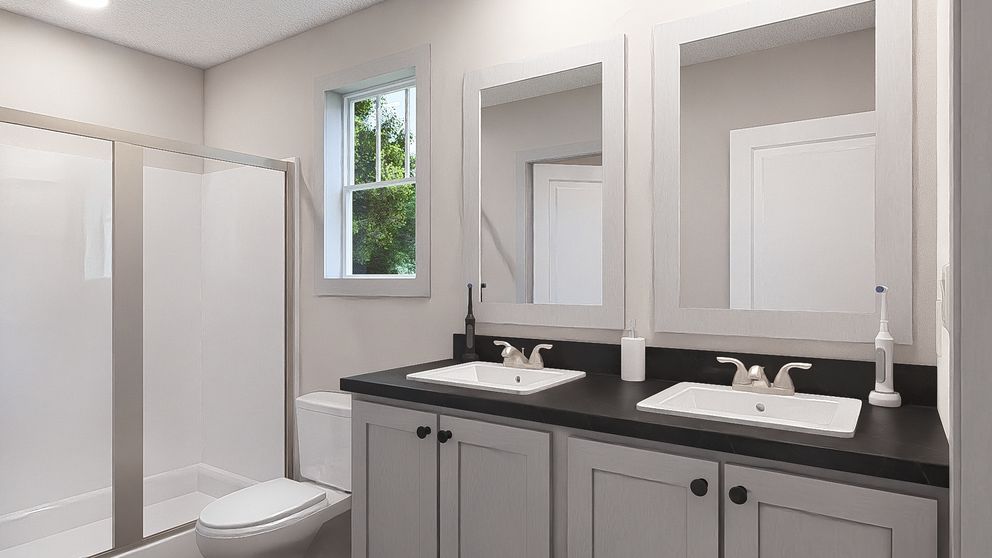 The RISING SUN Primary Bathroom. This Manufactured Mobile Home features 2 bedrooms and 2 baths.