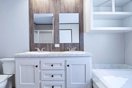 The ANNIVERSARY 16763S Primary Bathroom. This Manufactured Mobile Home features 3 bedrooms and 2 baths.