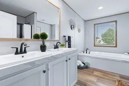 The EL SUENO BREEZE Primary Bathroom. This Manufactured Mobile Home features 4 bedrooms and 2 baths.