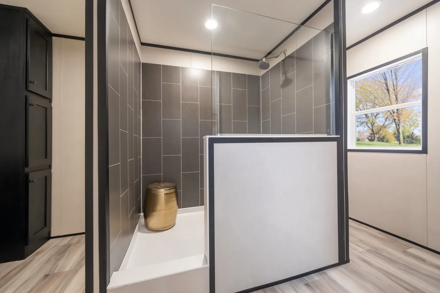 The THE SMOKEY Primary Bathroom. This Manufactured Mobile Home features 3 bedrooms and 2 baths.