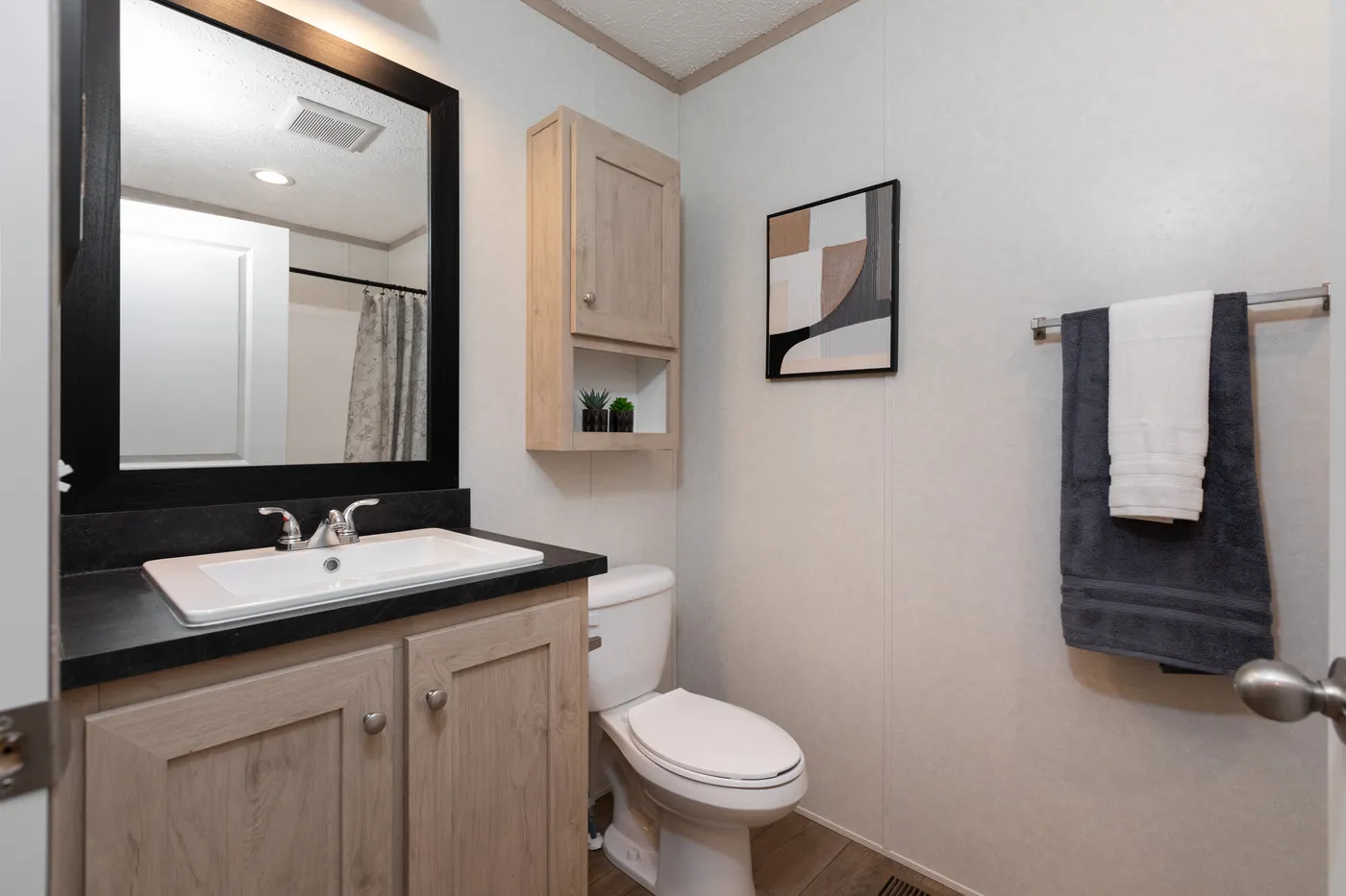 The 7616-4200 ADRENALINE Primary Bathroom. This Manufactured Mobile Home features 3 bedrooms and 2 baths.