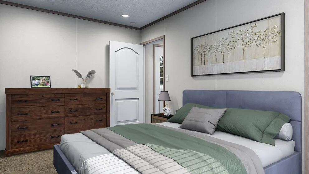 The 5616-4779 THE PULSE Primary Bedroom. This Manufactured Mobile Home features 2 bedrooms and 2 baths.