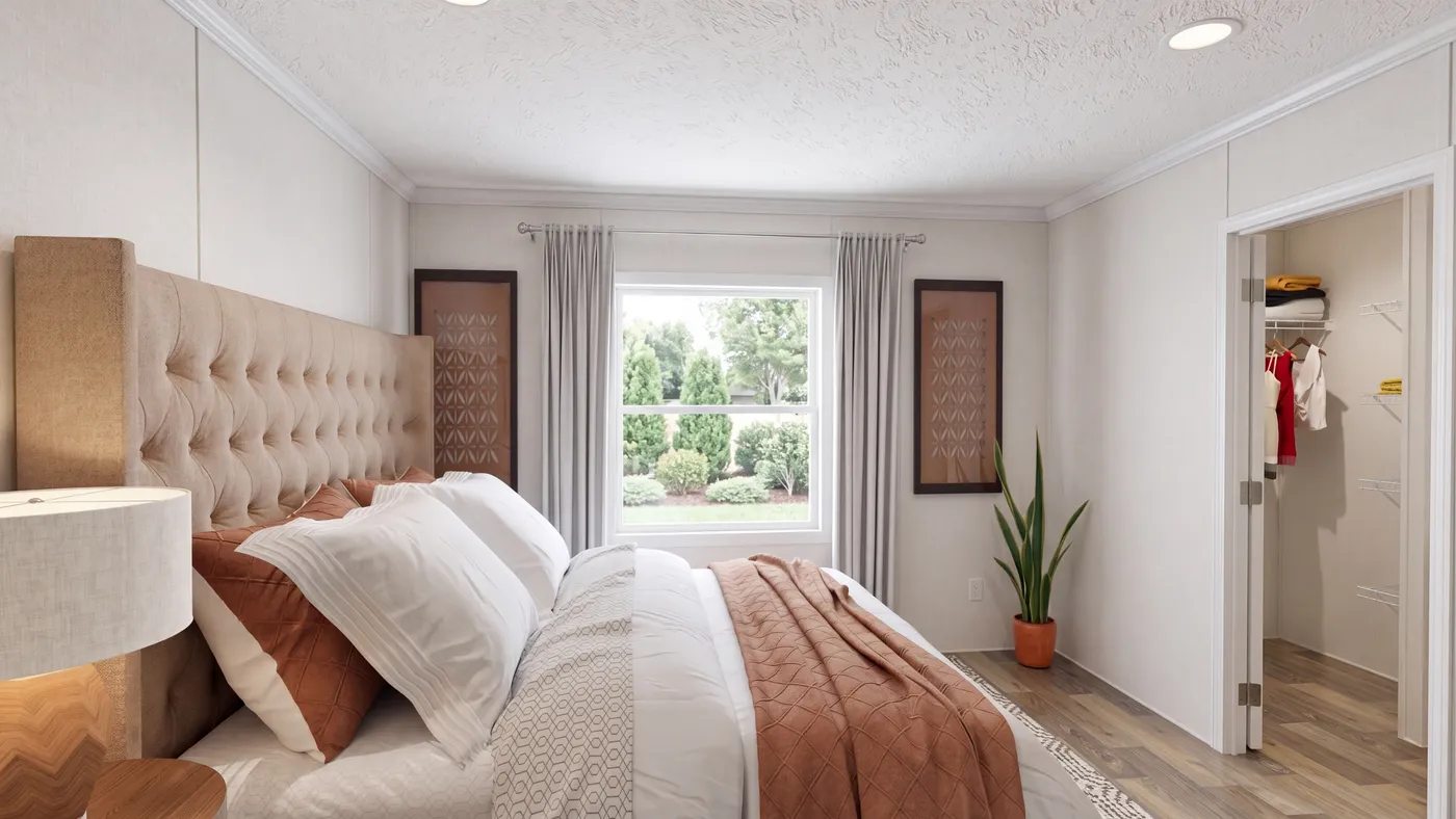 The HICKORY Primary Bedroom. This Manufactured Mobile Home features 3 bedrooms and 2 baths.