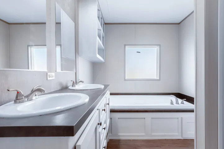 The ANNIVERSARY 16602A Primary Bathroom. This Manufactured Mobile Home features 2 bedrooms and 2 baths.