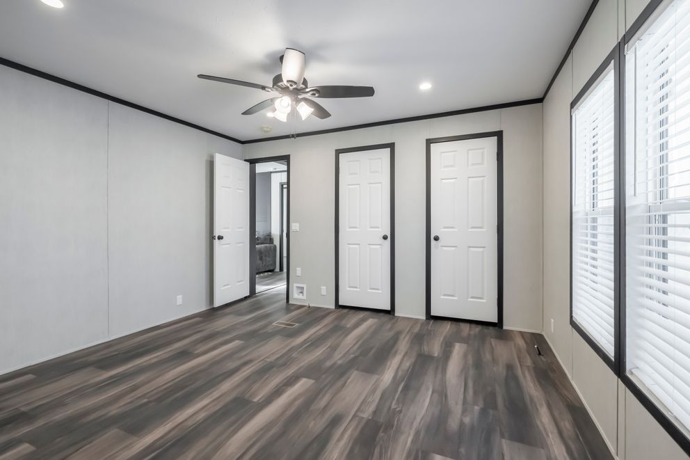 The LIL SOUTHERN CHARM Bedroom. This Manufactured Mobile Home features 3 bedrooms and 2 baths.