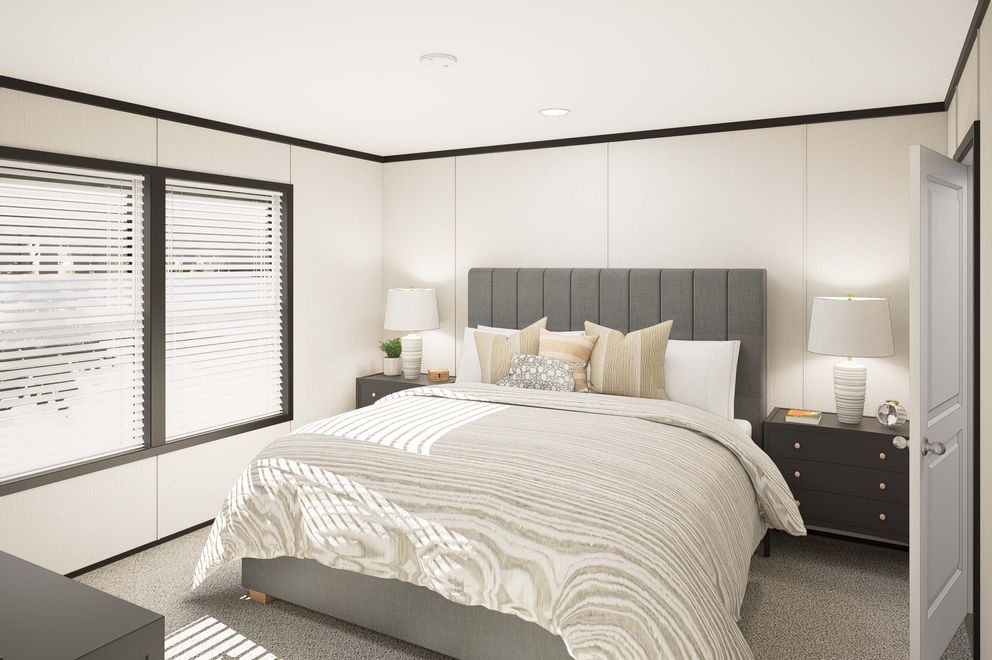 The PLATINUM ANNIVERSARY Primary Bedroom. This Manufactured Mobile Home features 3 bedrooms and 2 baths.